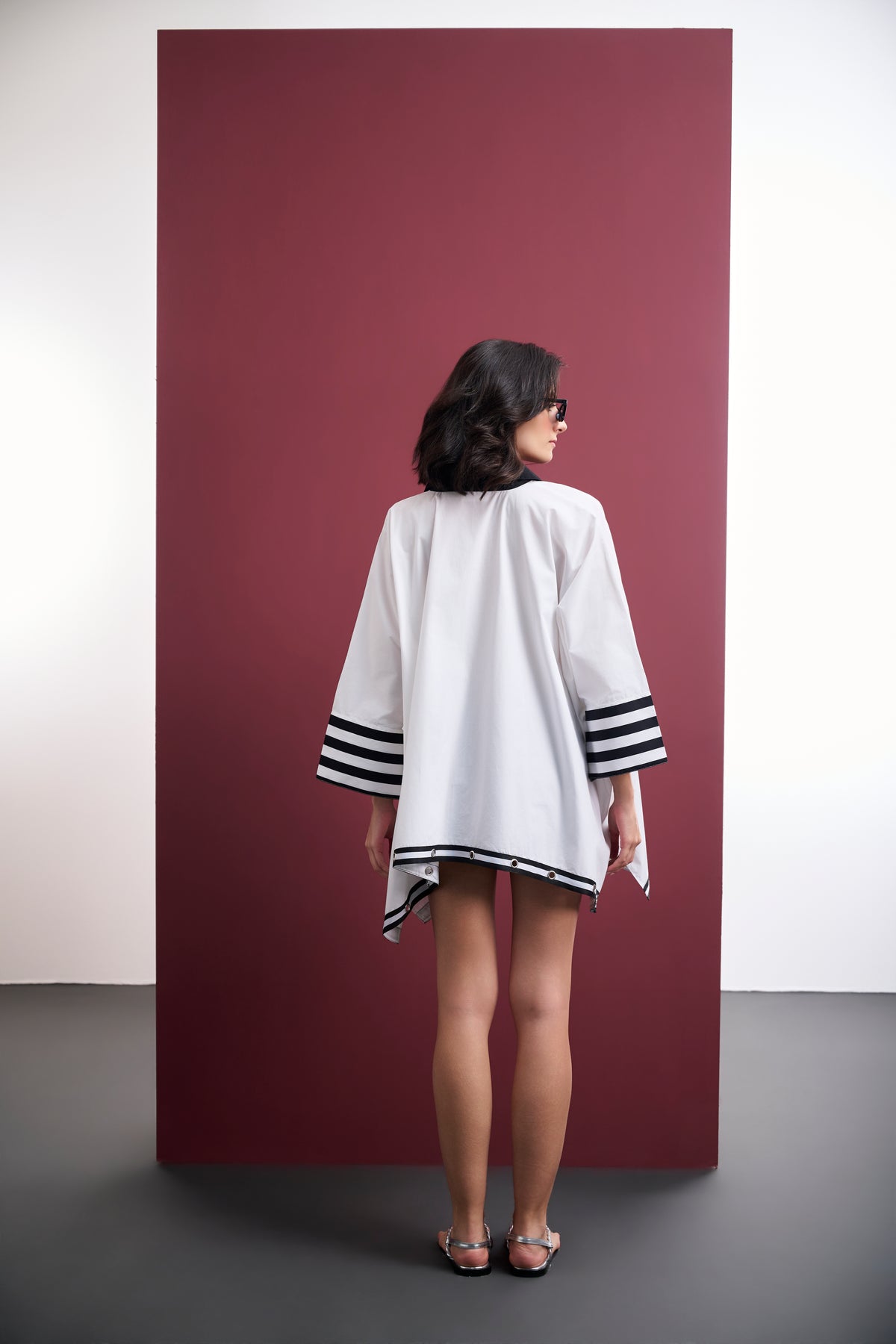 WHITE COTTON PONCHO SHIRT WITH BLACK FLORAL APPLIQUÉS