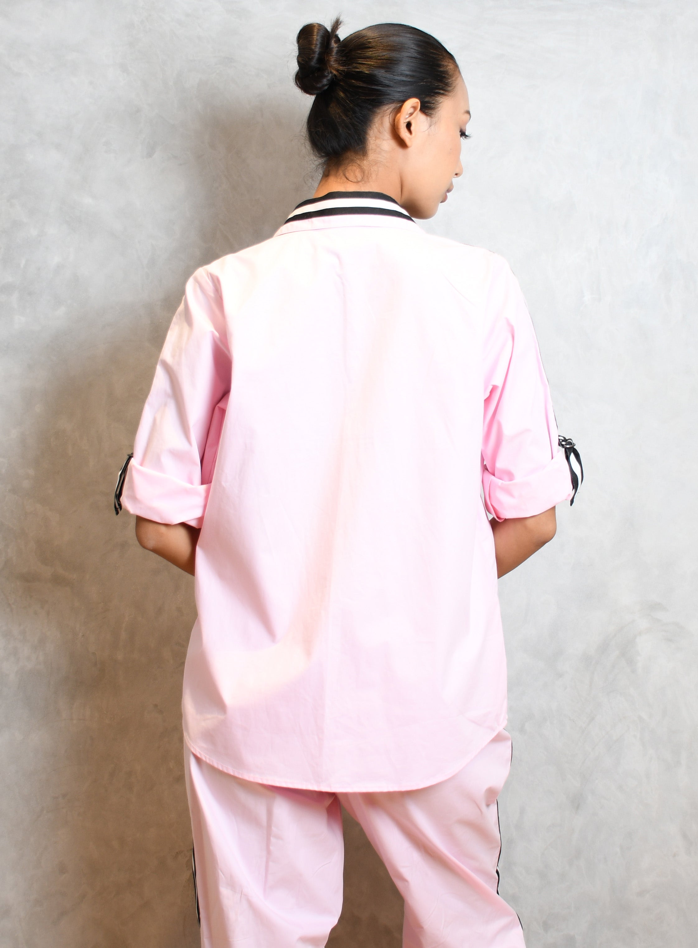 PINK SHIRT WITH MONOTONE FACE WITH BLACK & WHITE TAPE WITH STRAIGHT PANTS