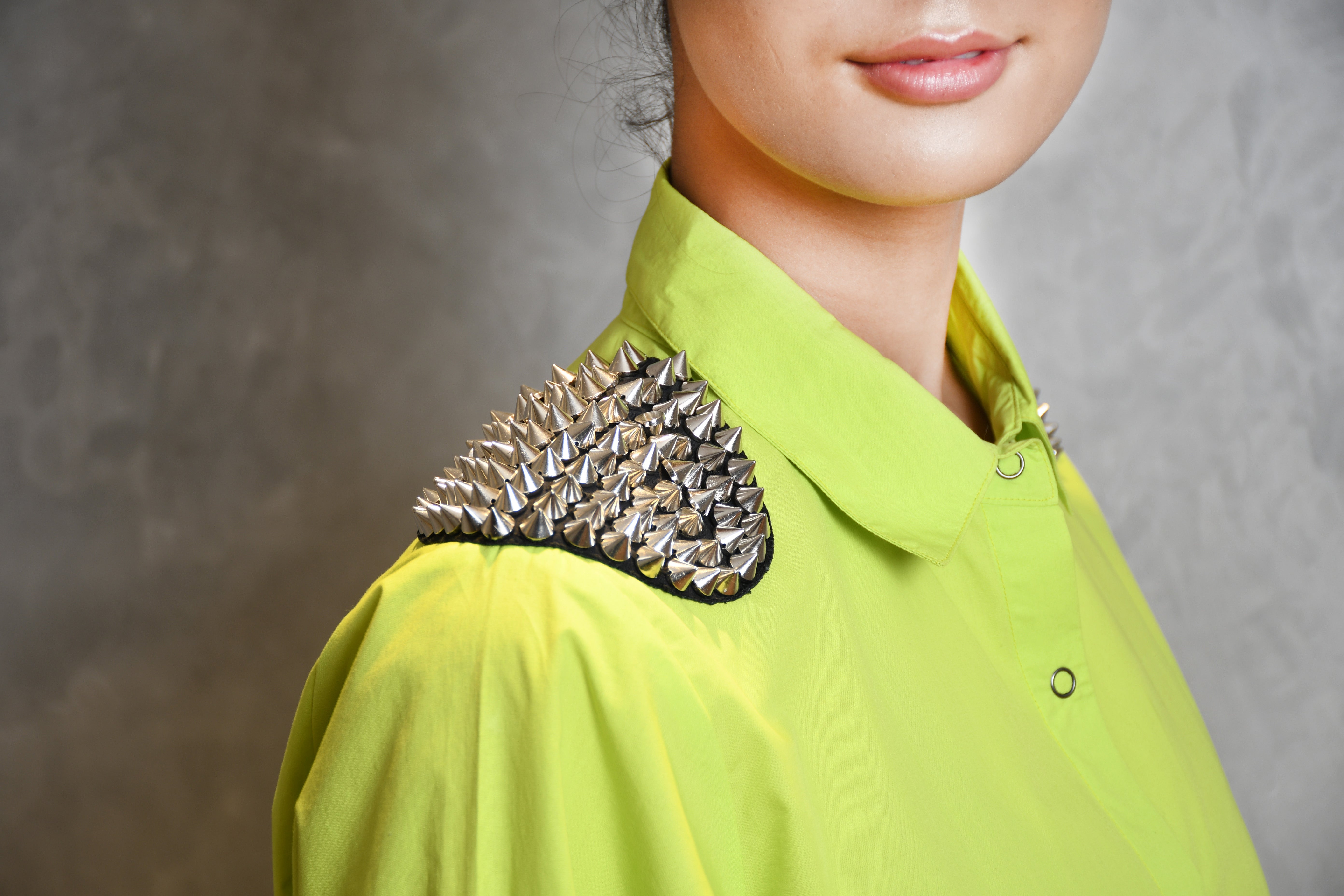 NEON GREEN SHIRT WITH SILVER SPIKE SHOULDER PATCH,TAPE DETAILINGS AND STRAIGHT PANTS