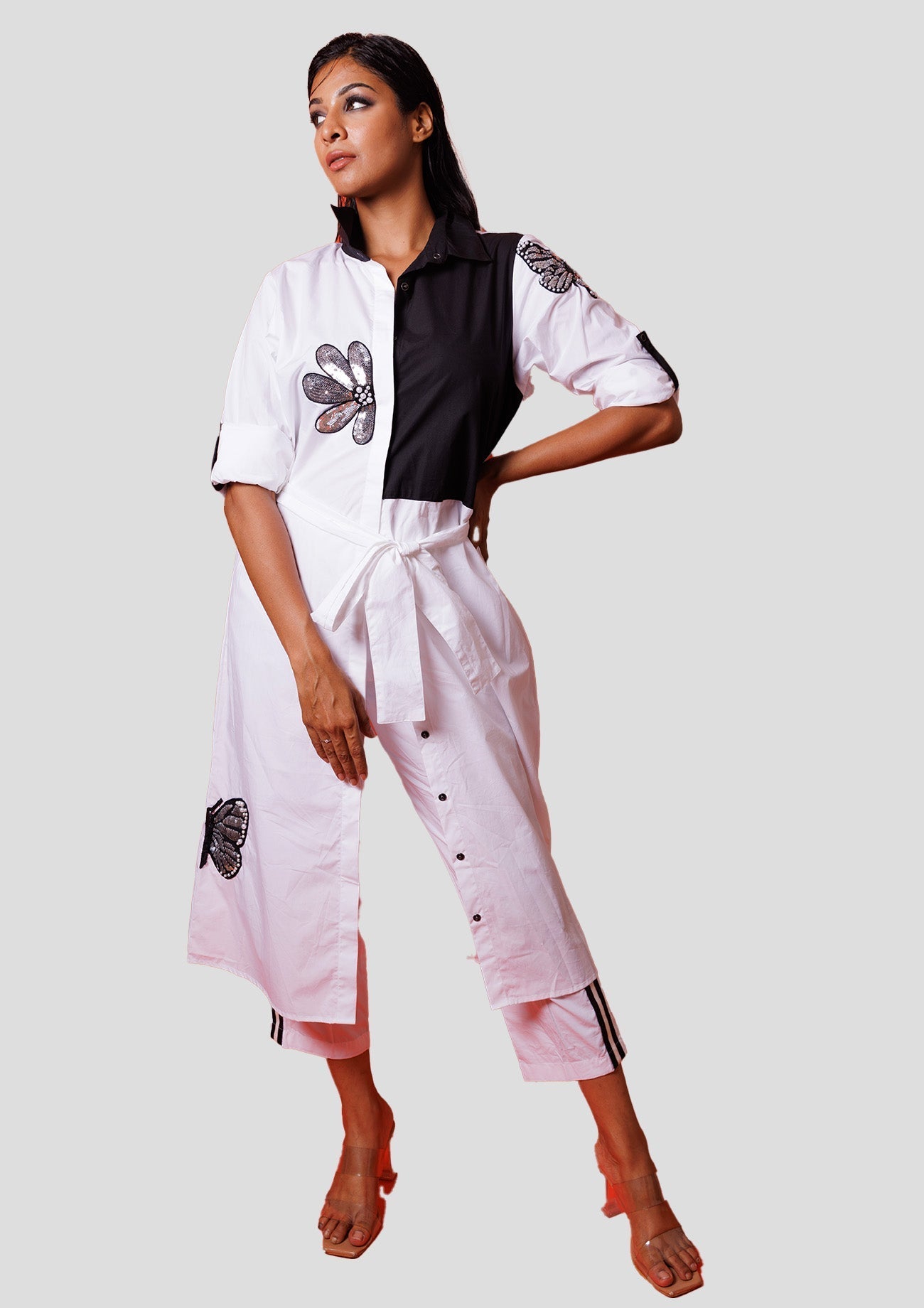 White Cotton Trench Shirt With Black Bodice And Silver Sequins Flower And Butterfly Embroidery With White Cotton Straight Pants